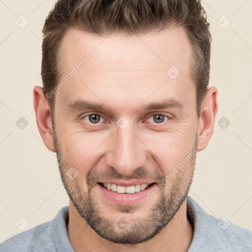 Joyful white adult male with short  brown hair and brown eyes