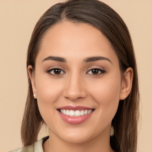 Joyful white young-adult female with long  brown hair and brown eyes