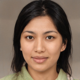 Joyful asian young-adult female with medium  black hair and brown eyes