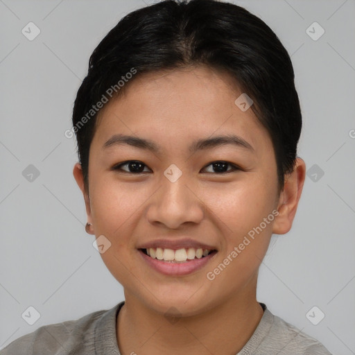 Joyful asian young-adult female with short  brown hair and brown eyes