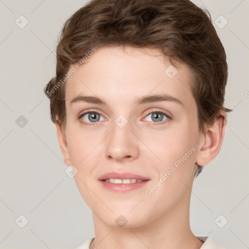 Joyful white young-adult female with short  brown hair and grey eyes