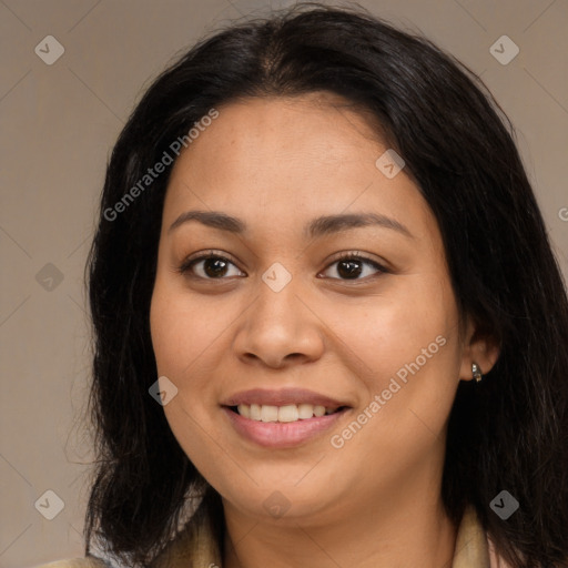 Joyful latino young-adult female with long  brown hair and brown eyes