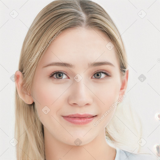 Joyful white young-adult female with long  brown hair and blue eyes