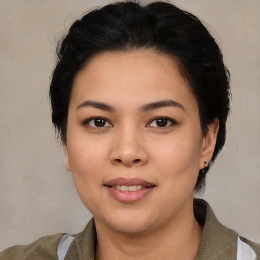 Joyful asian young-adult female with medium  black hair and brown eyes