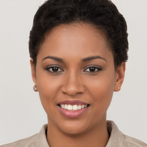 Joyful latino young-adult female with short  brown hair and brown eyes