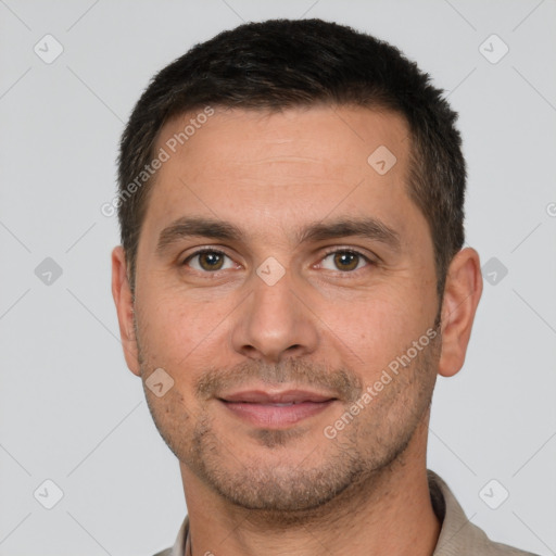 Joyful white adult male with short  brown hair and brown eyes