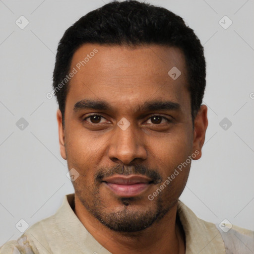 Joyful black young-adult male with short  black hair and brown eyes