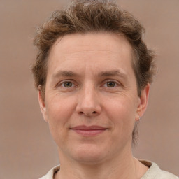 Joyful white adult male with short  brown hair and grey eyes