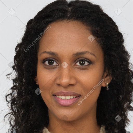 Joyful black young-adult female with long  brown hair and brown eyes