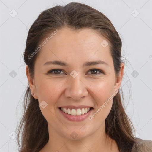 Joyful white young-adult female with long  brown hair and brown eyes