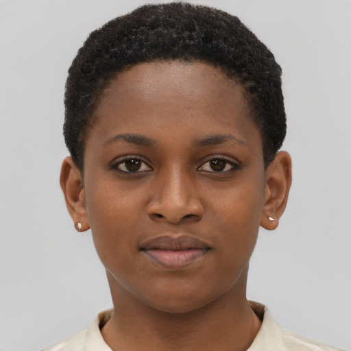 Joyful black young-adult female with short  brown hair and brown eyes