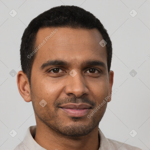 Joyful black young-adult male with short  black hair and brown eyes