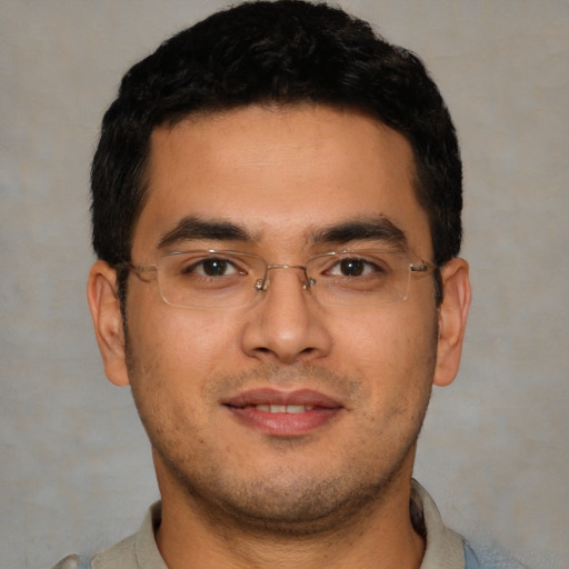 Joyful asian young-adult male with short  black hair and brown eyes