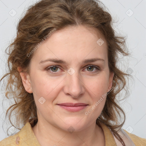 Joyful white young-adult female with medium  brown hair and blue eyes