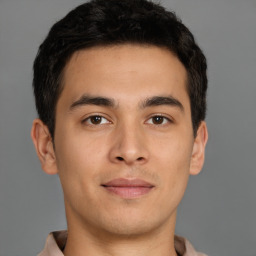 Joyful asian young-adult male with short  brown hair and brown eyes