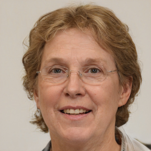 Joyful white middle-aged female with medium  brown hair and brown eyes