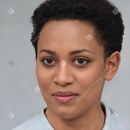 Joyful black young-adult female with short  brown hair and brown eyes