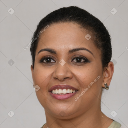 Joyful latino young-adult female with short  brown hair and brown eyes