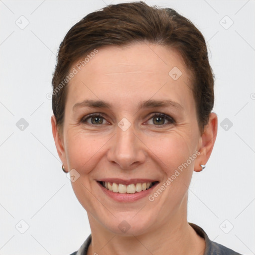 Joyful white adult female with short  brown hair and brown eyes