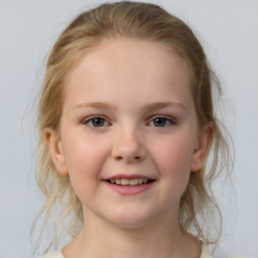 Joyful white child female with medium  brown hair and grey eyes