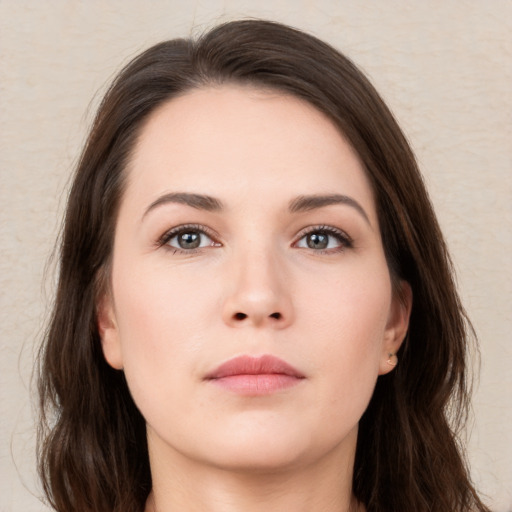 Neutral white young-adult female with long  brown hair and brown eyes