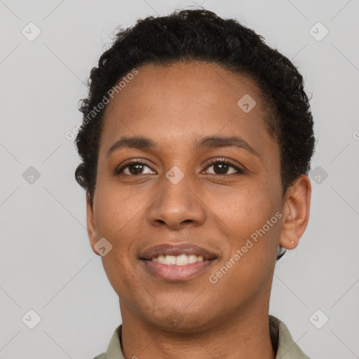 Joyful black young-adult female with short  brown hair and brown eyes