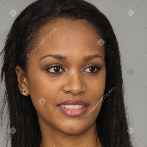 Joyful black young-adult female with long  brown hair and brown eyes