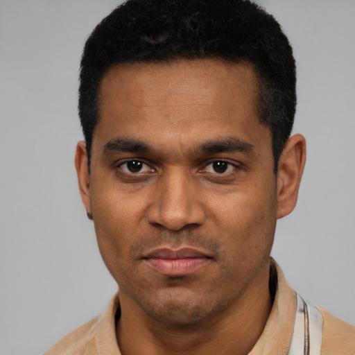 Neutral latino young-adult male with short  black hair and brown eyes