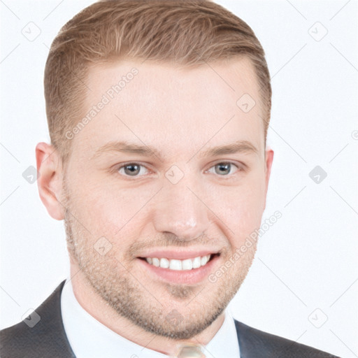 Joyful white young-adult male with short  brown hair and blue eyes