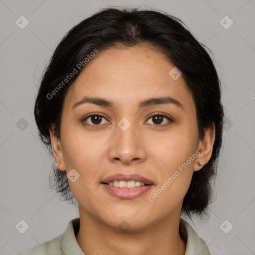 Joyful latino young-adult female with medium  brown hair and brown eyes