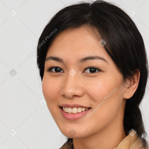 Joyful asian young-adult female with medium  black hair and brown eyes