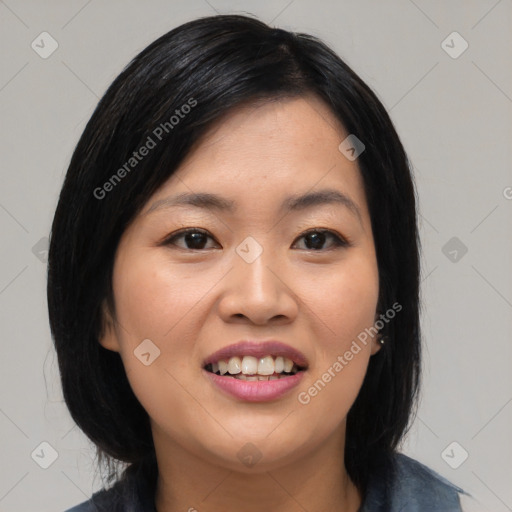 Joyful asian young-adult female with medium  black hair and brown eyes