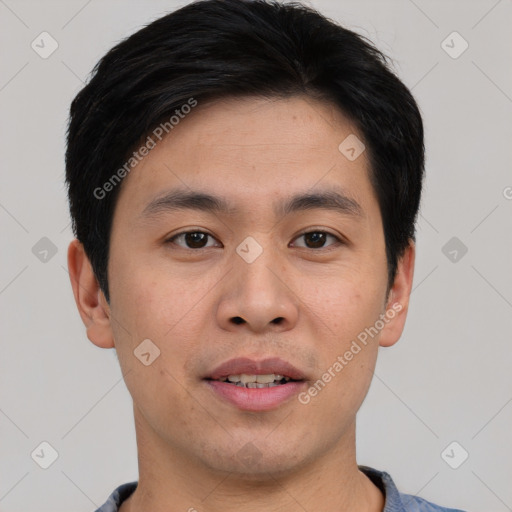 Joyful asian young-adult male with short  black hair and brown eyes