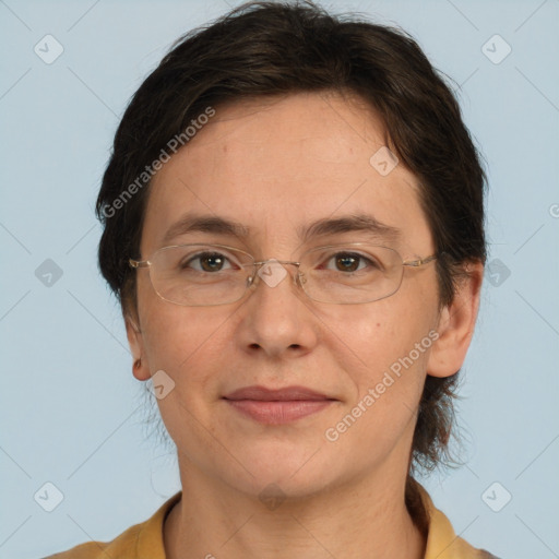 Joyful white adult female with short  brown hair and brown eyes