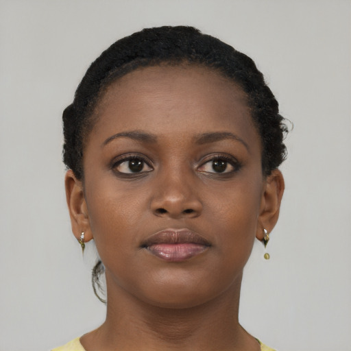 Neutral black young-adult female with short  brown hair and brown eyes