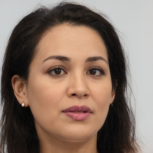 Joyful white young-adult female with long  brown hair and brown eyes