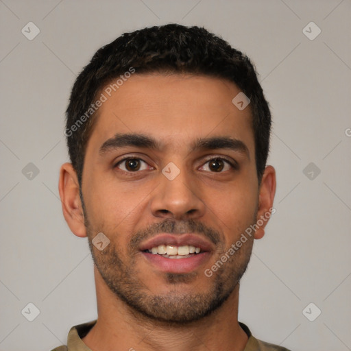 Joyful latino young-adult male with short  brown hair and brown eyes