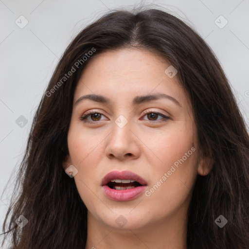 Joyful white young-adult female with long  brown hair and brown eyes