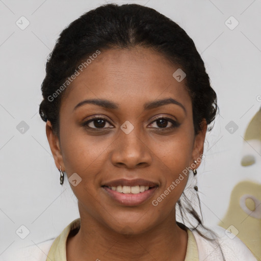 Joyful black young-adult female with short  black hair and brown eyes