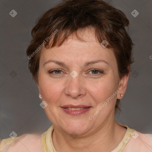 Joyful white adult female with short  brown hair and brown eyes