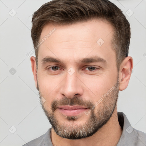 Neutral white young-adult male with short  brown hair and brown eyes