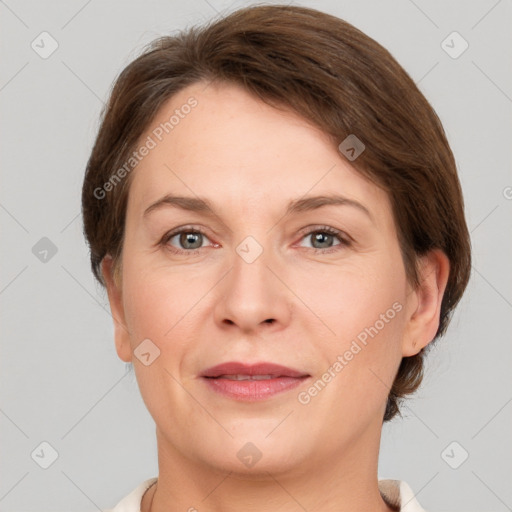 Joyful white adult female with short  brown hair and grey eyes