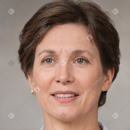 Joyful white adult female with short  brown hair and brown eyes