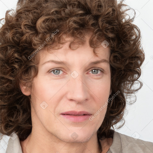 Joyful white adult female with medium  brown hair and green eyes