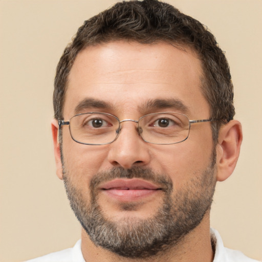 Joyful white adult male with short  brown hair and brown eyes