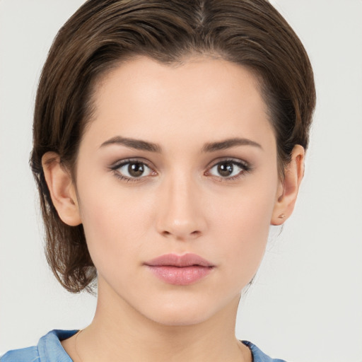 Neutral white young-adult female with medium  brown hair and brown eyes