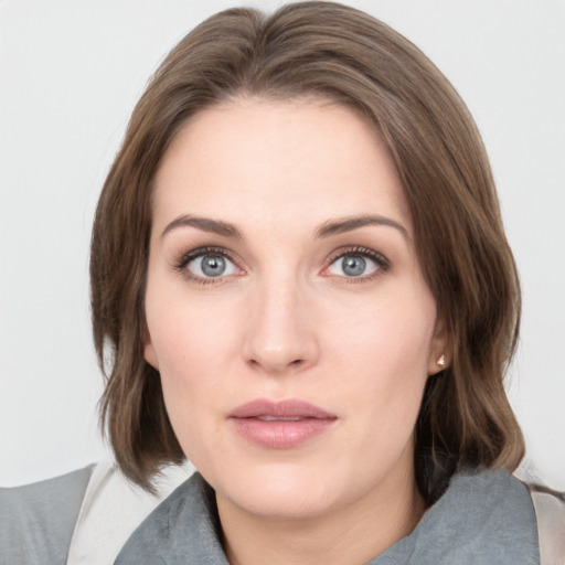 Neutral white young-adult female with medium  brown hair and grey eyes