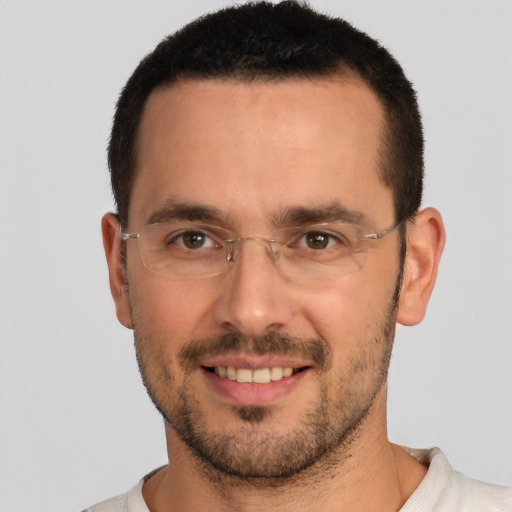 Joyful white young-adult male with short  brown hair and brown eyes