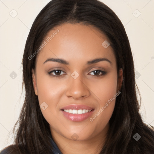 Joyful latino young-adult female with long  brown hair and brown eyes