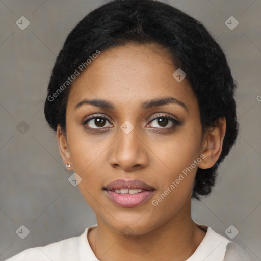 Joyful black young-adult female with short  black hair and brown eyes